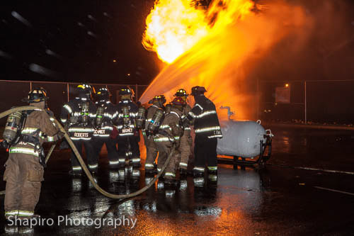 firefighters fighting propane fire big flames heavy fire